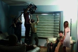 A still from the set of the short film Apparitions. Film crew actively doing a shot.