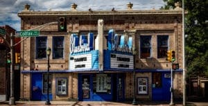 The front of an old movie theatre used by a production company