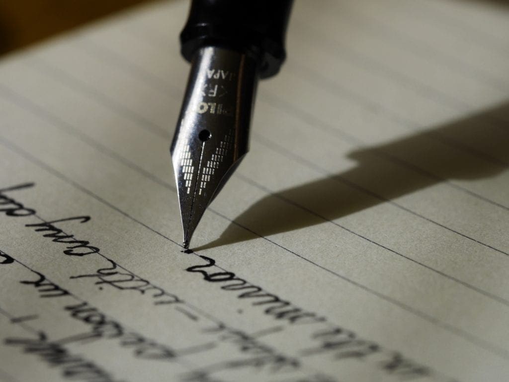 <s>7 Deadly Sins of Screenwriting - Vancouver | June 21, 2019</s> 2 Someone screenwriting with a pen