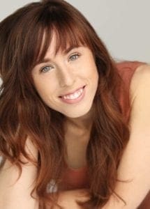 Sarah Tolle Headshot Bright Orange Smile Low Res