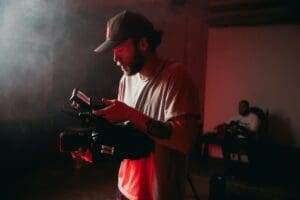 Home 6 slate filmmaker holding cinema camera